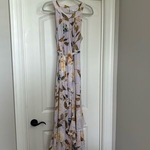Calvin Klein size 12 floral cocktail dress with layered hem. Fully lined.